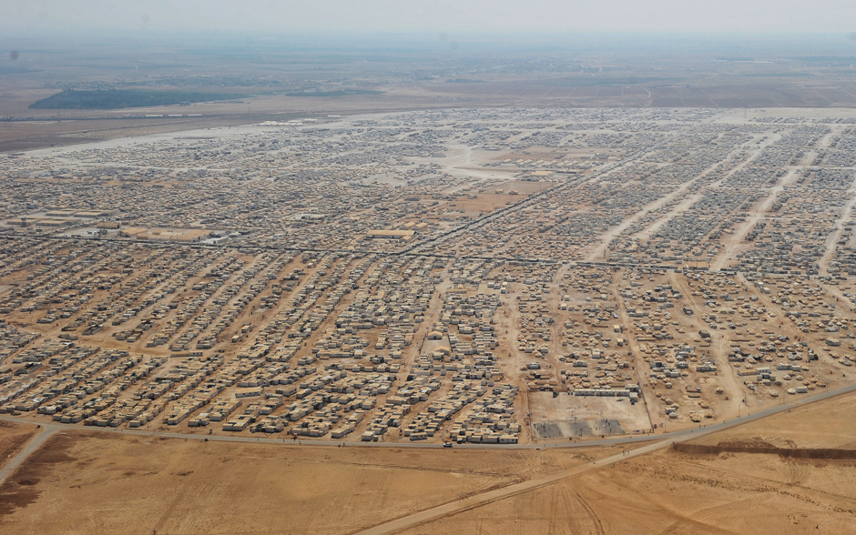 CAPTION CORRECTION - NUMBER OF REFUGEES An aerial view shows the Zaatari refugee camp on July 18, 2013 near the Jordanian city of Mafraq, some 8 kilometers from the Jordanian-Syrian border. The northern Jordanian Zaatari refugee camp is home to 115,000 Syrians. AFP PHOTO/MANDEL NGAN/POOLMANDEL NGAN/AFP/Getty Images