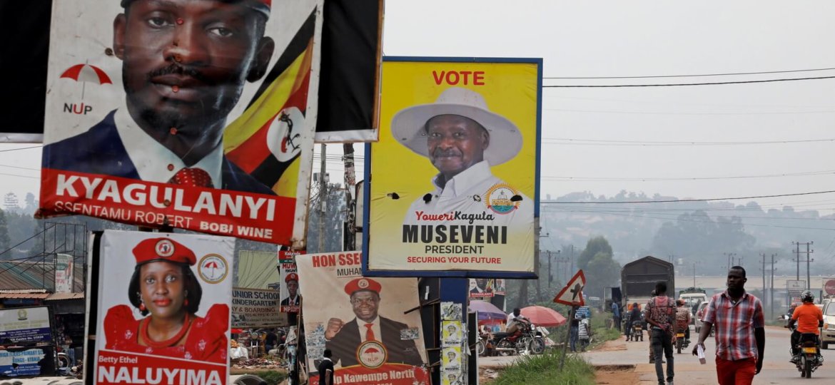 Elections billboards for Uganda's President Yoweri Museveni, and opposition leader and presidential candidate Robert Kyagulanyi, also known as Bobi Wine, are seen on a street in Kampala